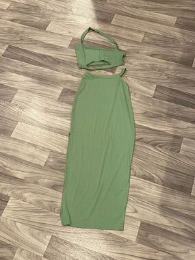 Woman’s green two piece top and skirt set size small.
